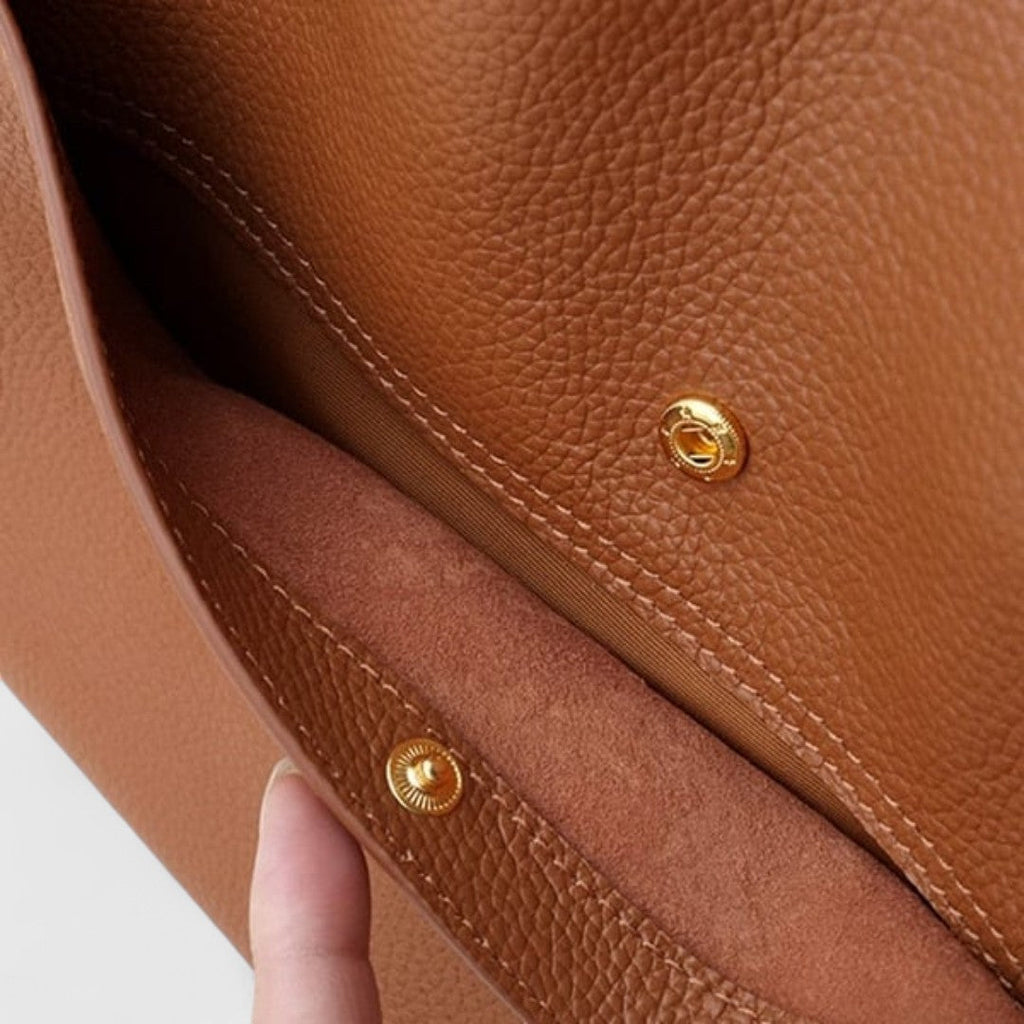 Plousia - Borsa a tracolla in pelle dal design semplice ed elegante